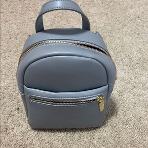 Compact Blue Backpack with Minimalist Design